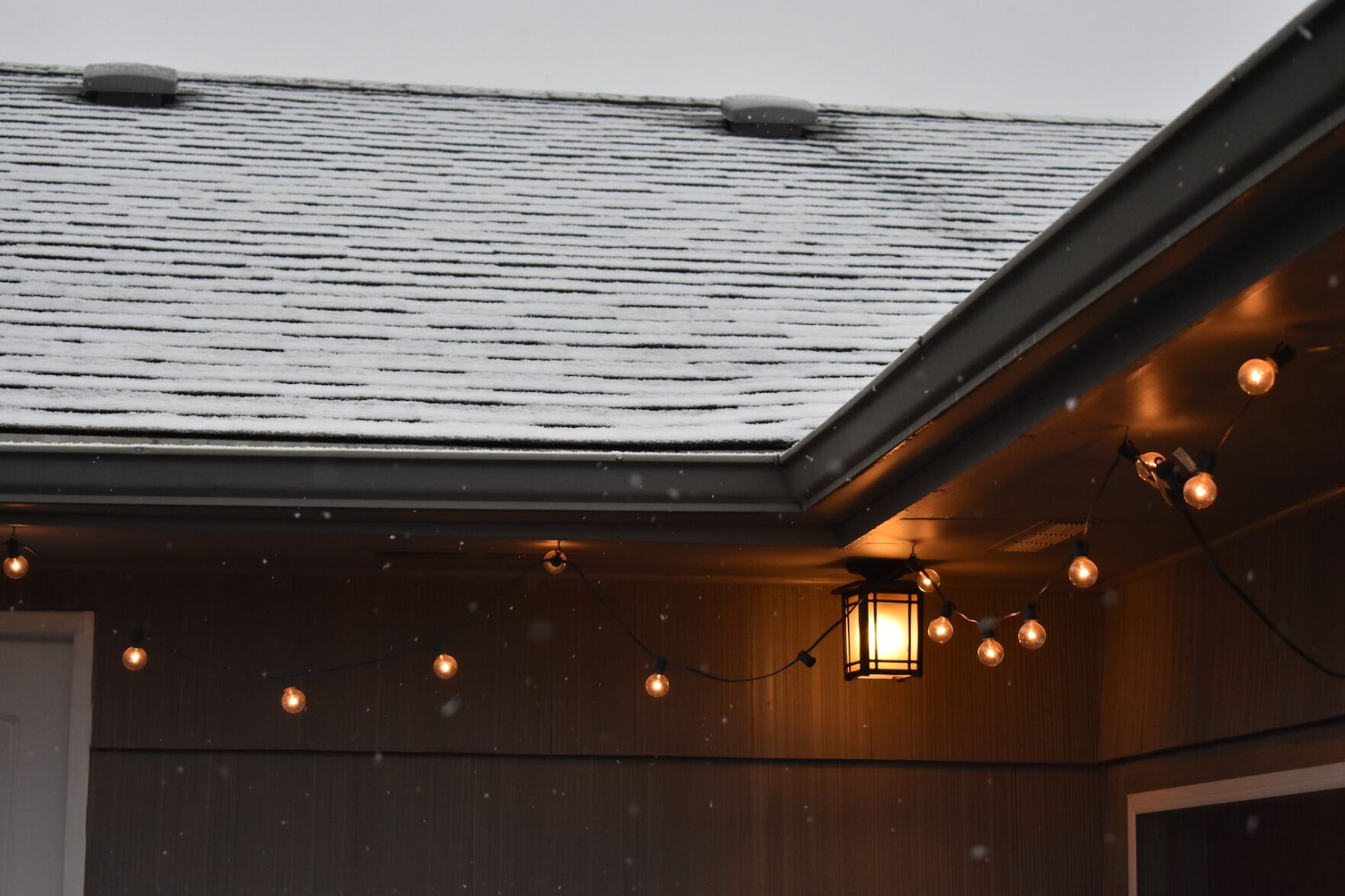 Outdoor lighting, like seen on this roofline, can increase the curb appeal and safety of a home